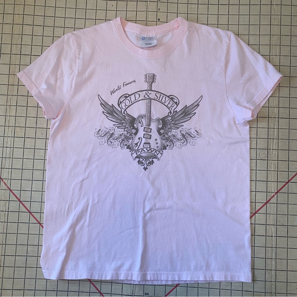 Gold and Silver Pawn women’s Light Pink Graphic Tee, guitar and wings, size M
